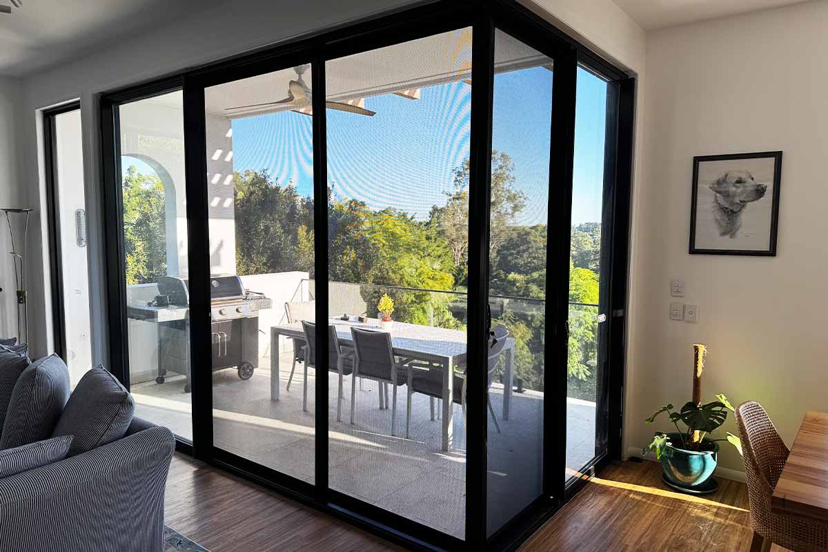 Prowler Proof sliding security doors on a corner stacking door system.